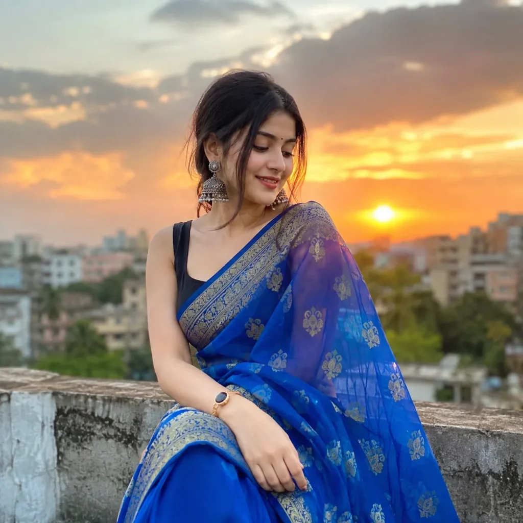 Beautiful woman wearing a blue saree in a stylish pose  